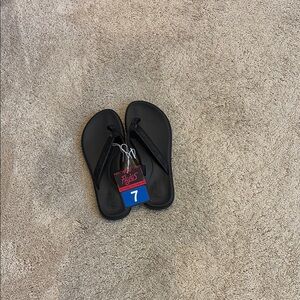 Black Flip Flop Sandals with Size Tag